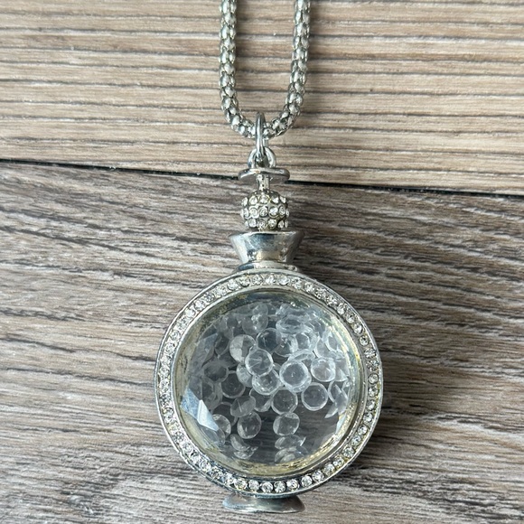 Jewelry - long silver necklace with rhinestone detailing and rhinestone charm